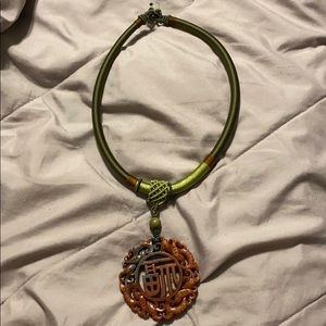 Nephrite jade hand carved pendant and so cord